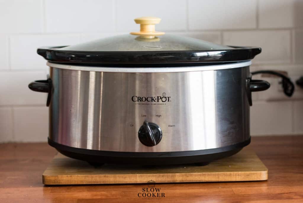 vertical image of a crock pot slow cooker.