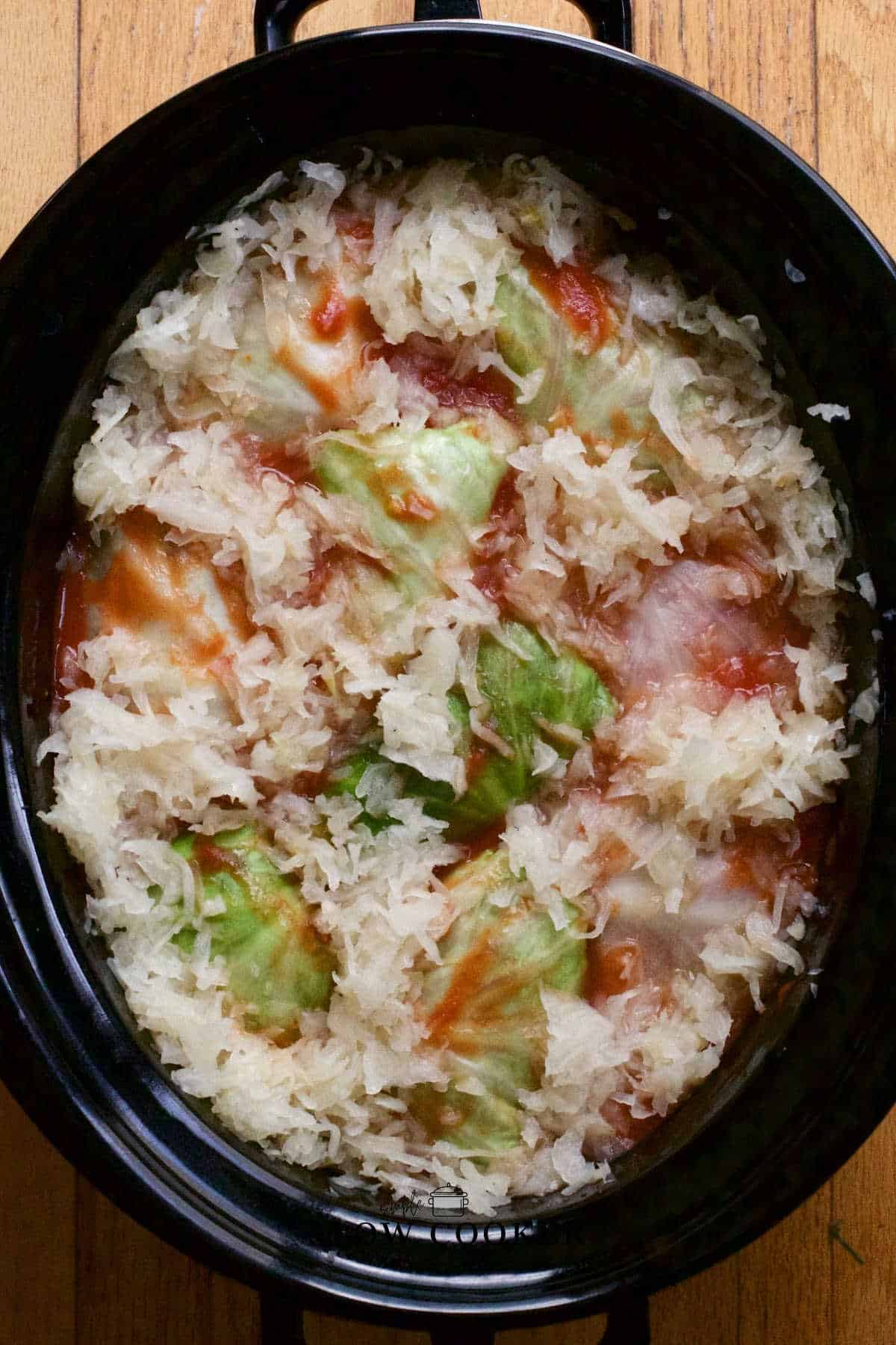 Slow Cooker Cabbage Rolls with sauerkraut and tomato sauce.
