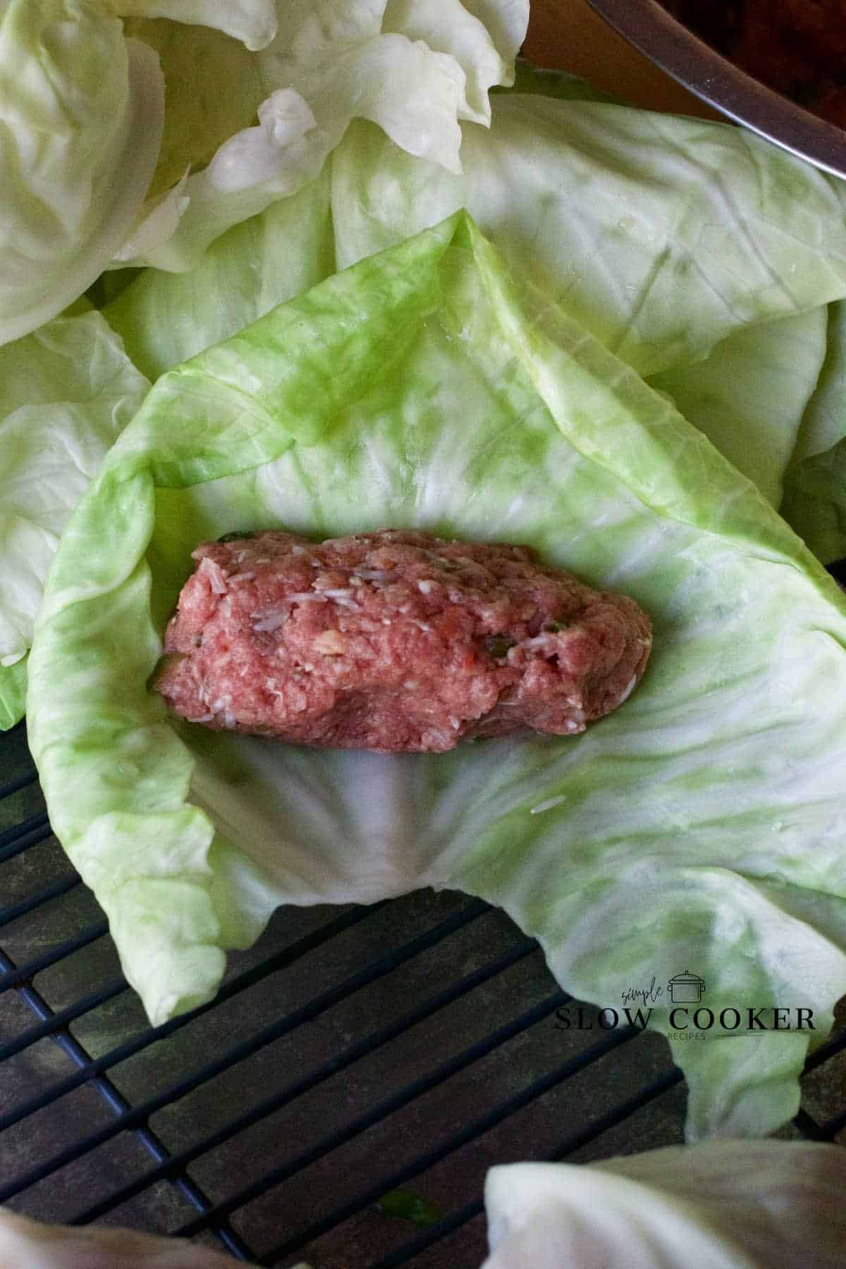 portion of meat mixture in a steamed cabbage leaf.