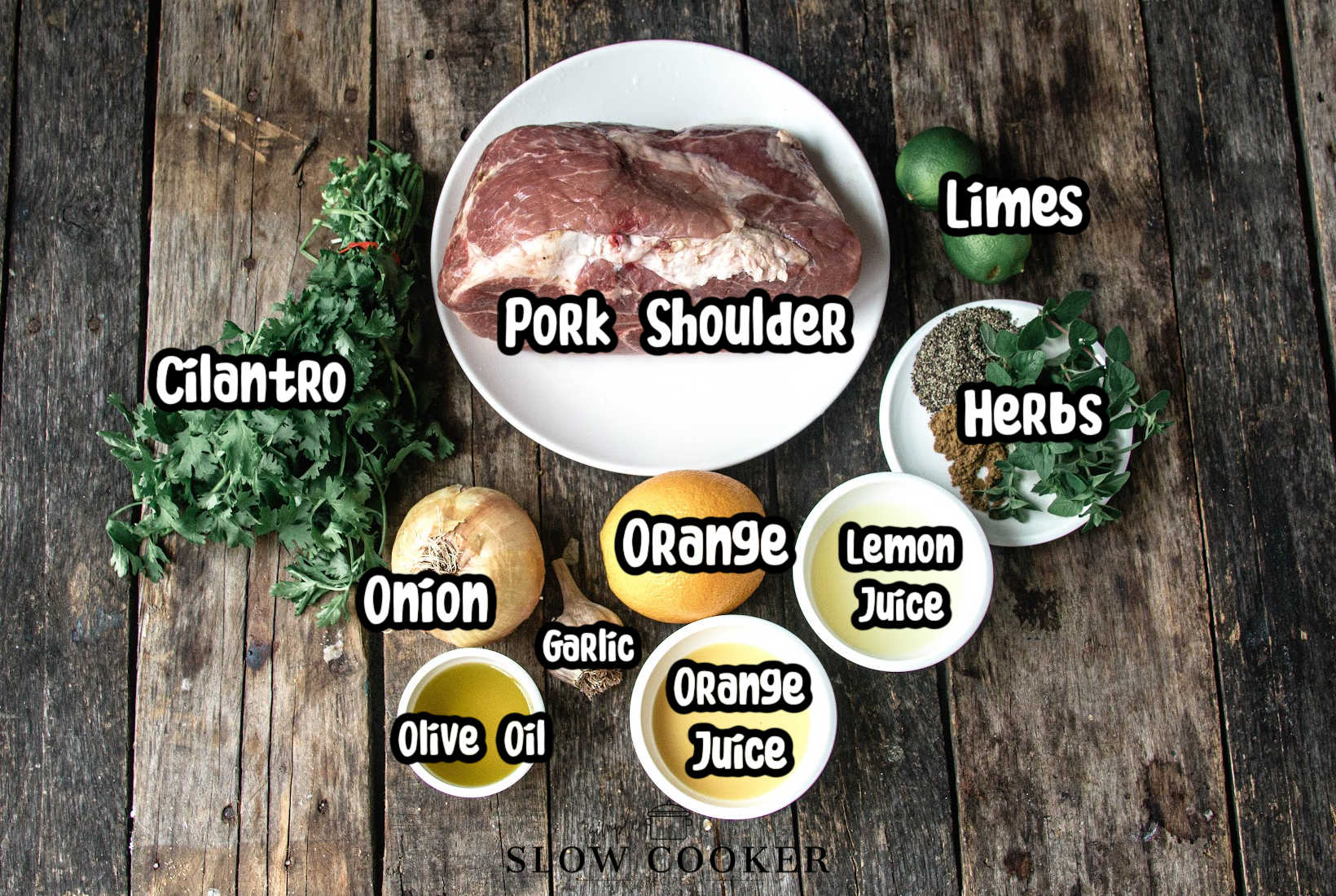 mojo pork ingredients, crockpot, pork shoulder, cilantro, onion, olive oil, garlic, orange, orange juice, lemon Juice, herbs, Limes with text overlay labeling them.