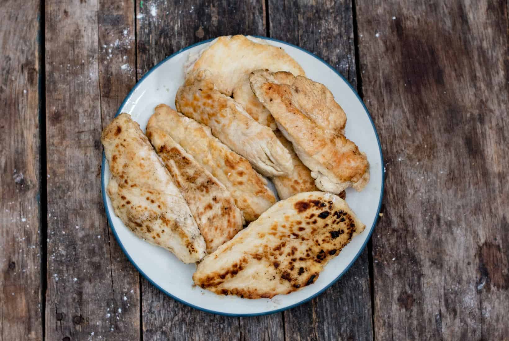 browned chicken breasts on a plate,