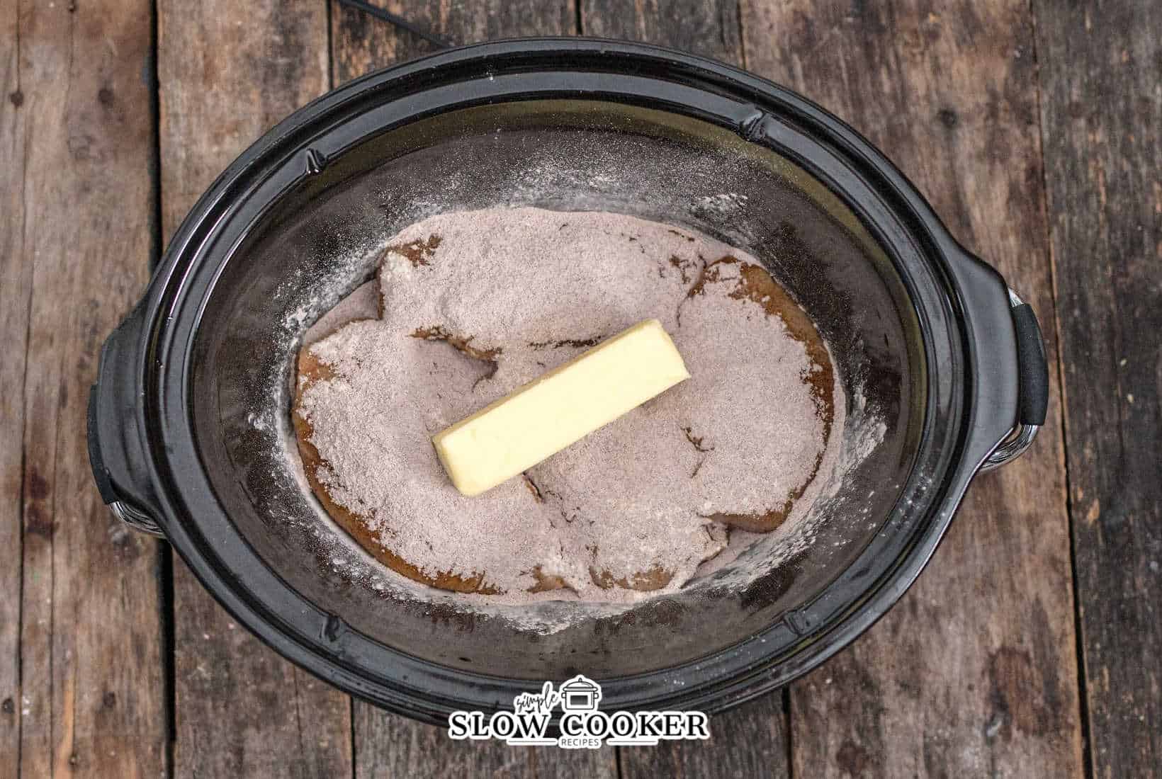 butter added to the slow cooker.