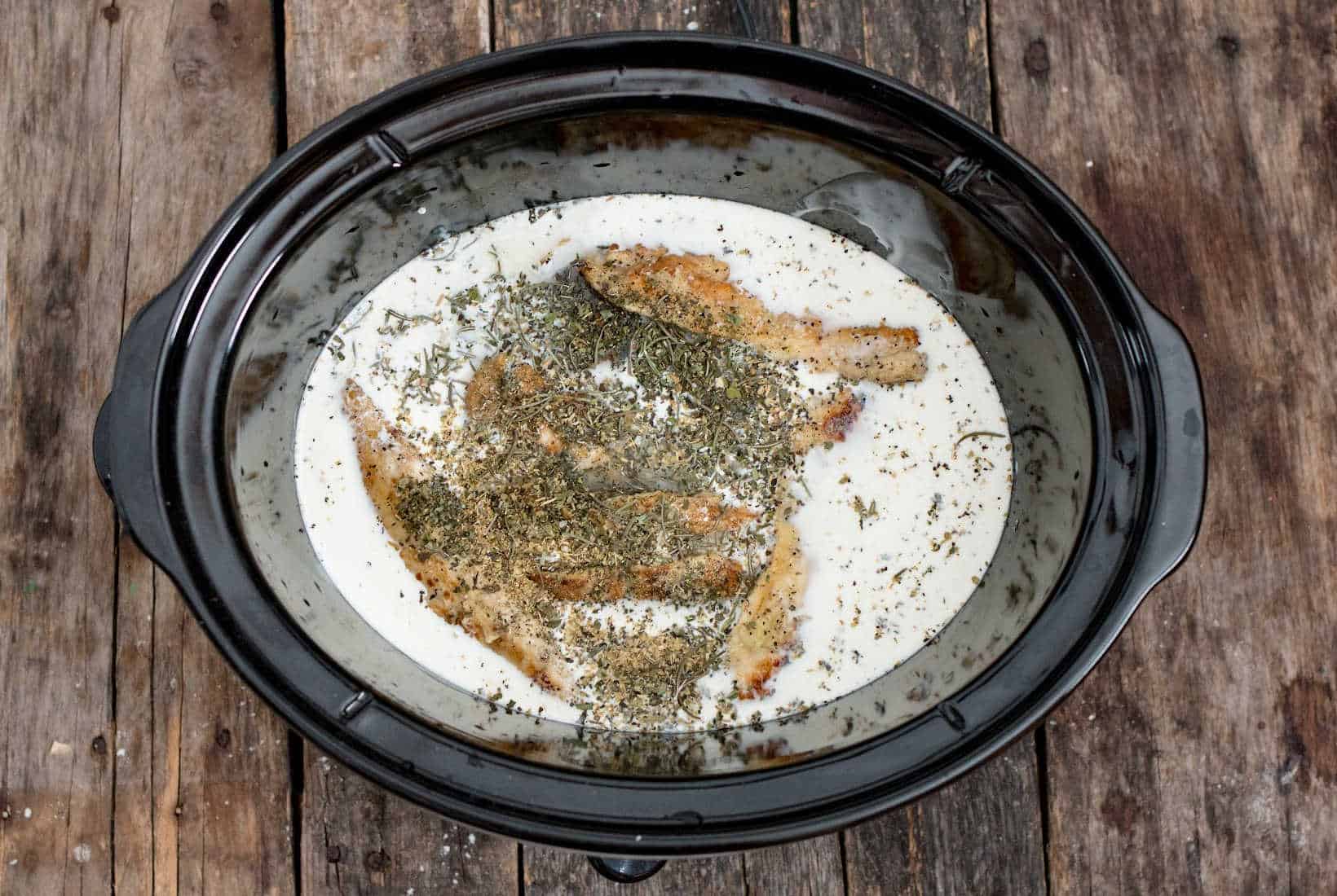 heavy cream added to the slow cooker for Marry Me Chicken