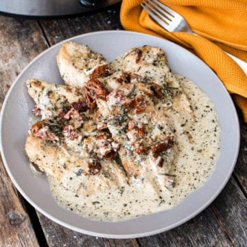 top down image of Marry Me Chicken on a grey plate.